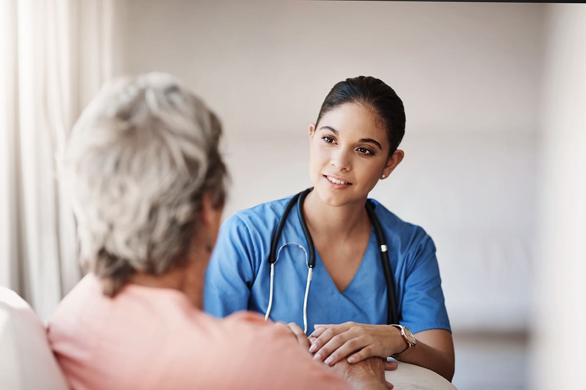 Support, healthcare and nurse with a senior patient explaining a diagnosis after consultation. Medical, empathy and female caretaker volunteer consoling an elderly lady in retirement at nursing home.
